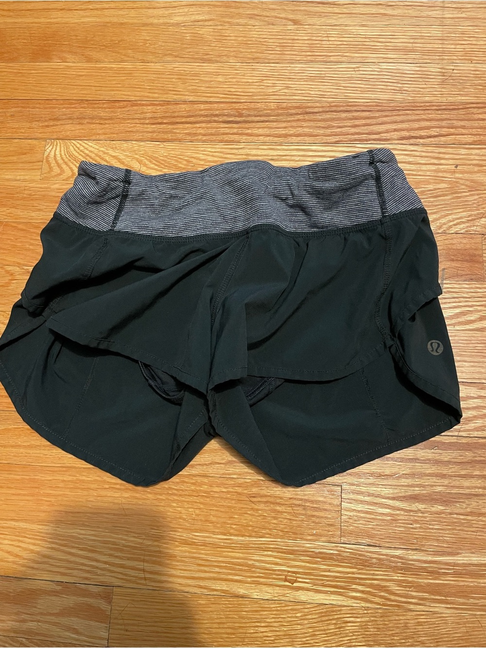 Lululemon athletica black running shorts with grey striped waistband